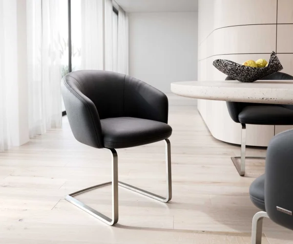 Cantilever Caja-Flex avec accoudoirs cuir de vache noir pied cantilever plat acier inoxydable brossé ressorts ensachés