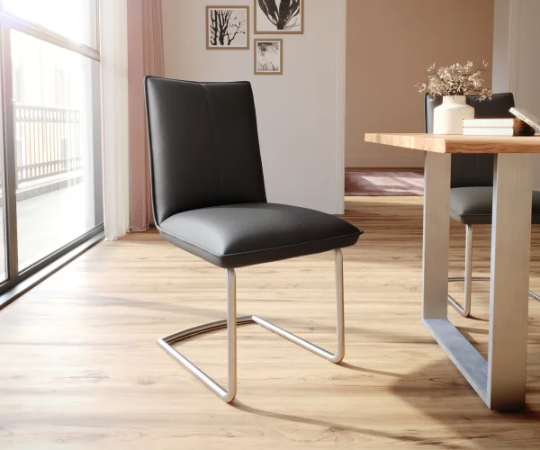 Cantilever Lelio-Flex cuir de vache noir pied cantilever rond acier inoxydable brossé ressorts ensachés