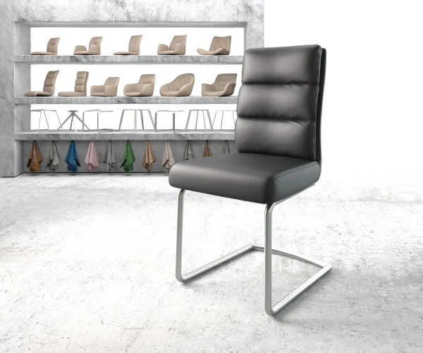 Cantilever Pela-Flex cuir de vache noir pied cantilever rond acier inoxydable brossé ressorts ensachés