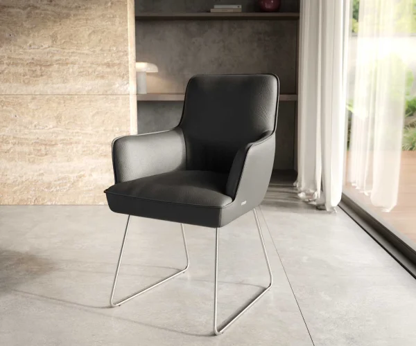 Chaise-de-salle-à-manger Heira-Flex avec accoudoirs cuir de vache noir pied trapèze acier inoxydable brossé ressorts ensachés