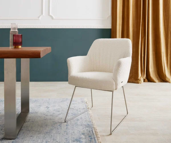 Chaise-de-salle-à-manger Xana-Flex avec accoudoirs bouclé blanc pied trapèze acier inoxydable brossé ressorts ensachés