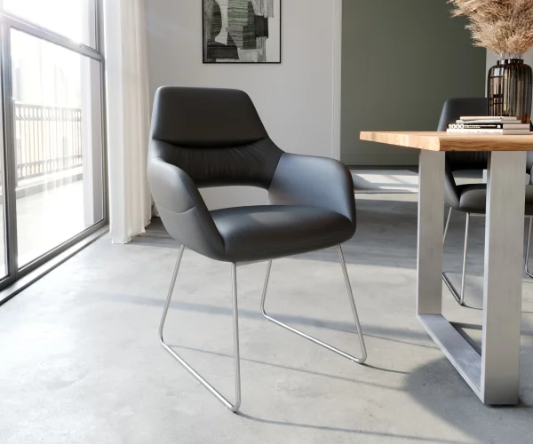 Chaise-de-salle-à-manger Yago-Flex avec accoudoirs cuir de vache noir pied trapèze acier inoxydable brossé ressorts ensachés