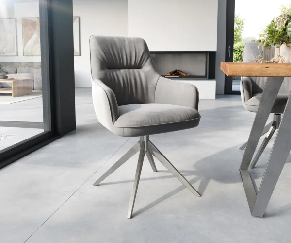 Chaise-de-salle-à-manger Zelia-Flex avec accoudoirs velours gris pied croisé large acier inoxydable brossé ressorts ensachés